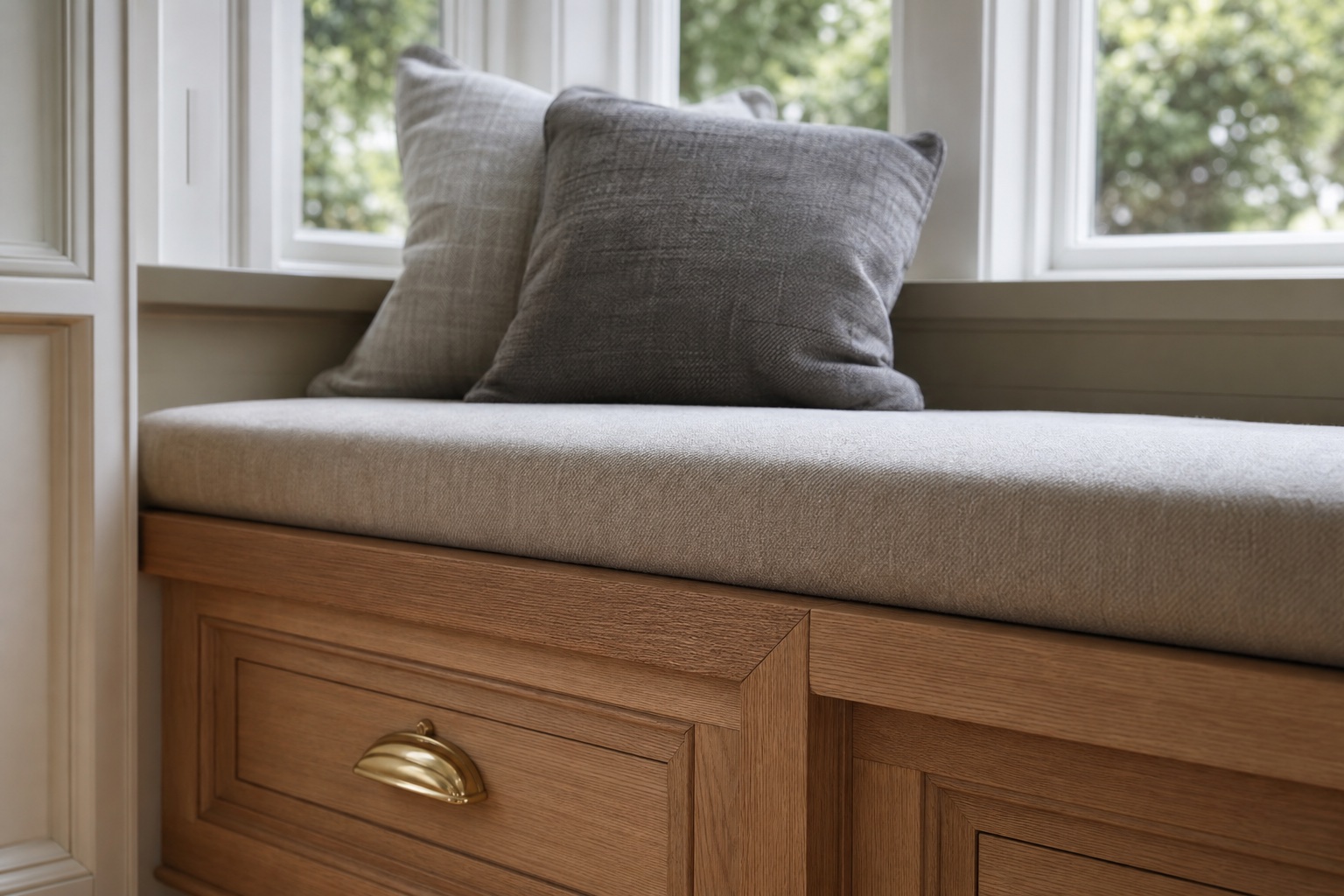 Oak seat board and painted cabinetry detail